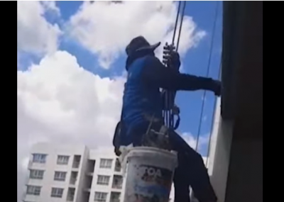 Mujer corta cuerda que sostenía a dos pintores en piso 26 de edificio [VIDEO]